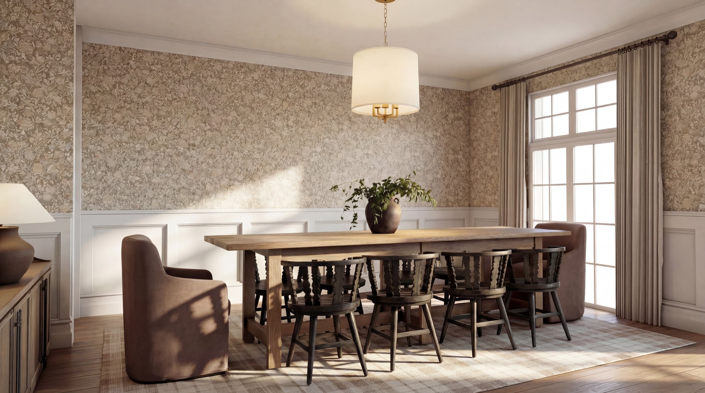 Dining room at Stone Hollow Cottage with patterned wallcovering, wainscoting and a long oak table